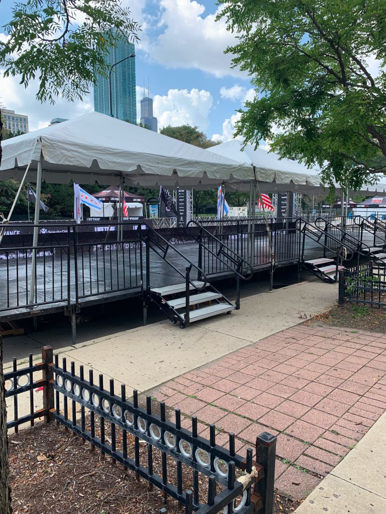 Large white tents set up outside.