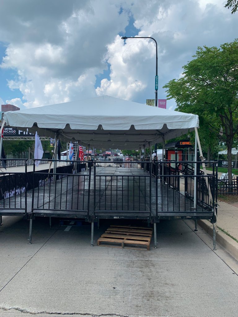 Large white tents set up outside.