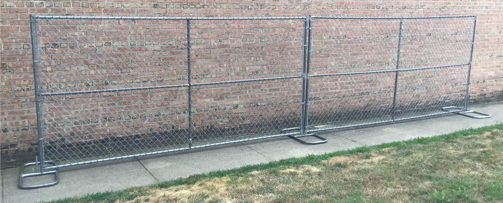 Standard chain link perimeter patrol fencing set up outside.
