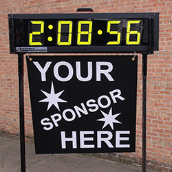 Clock with sign demonstrating where sponsor's sign would hang.