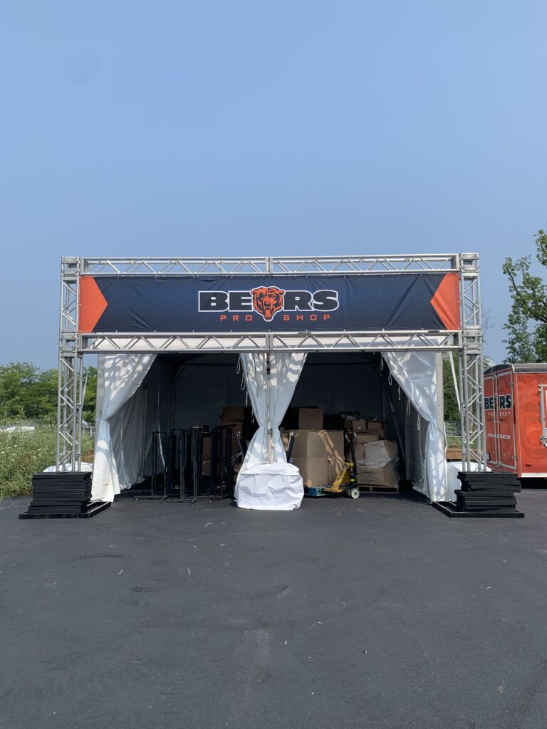 Chicago Bears Pro Shop tent set up outside.