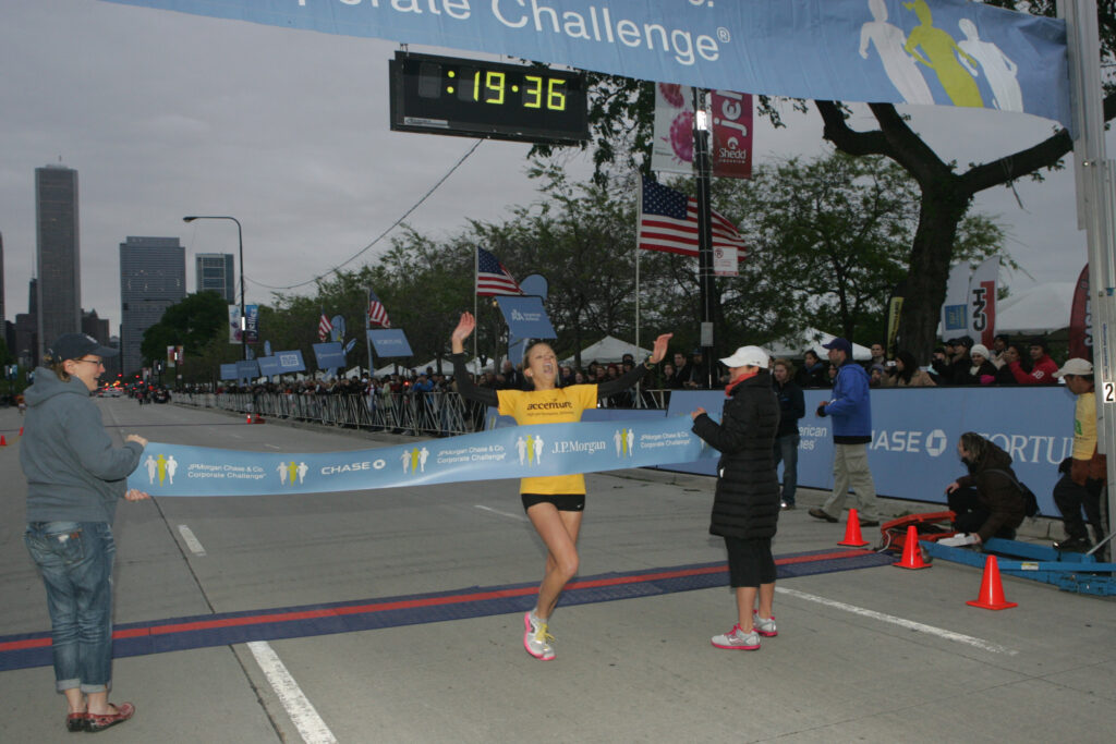 Woman crossing a finish line.