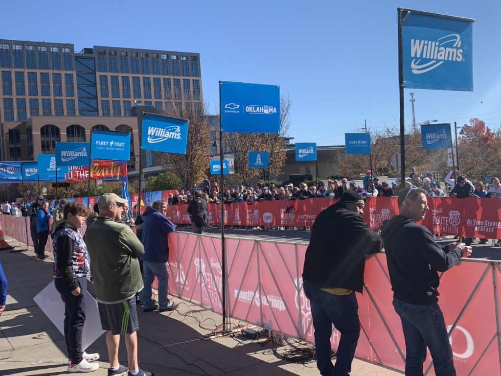 L-Poles set up outside at finish line with many spectators watching.