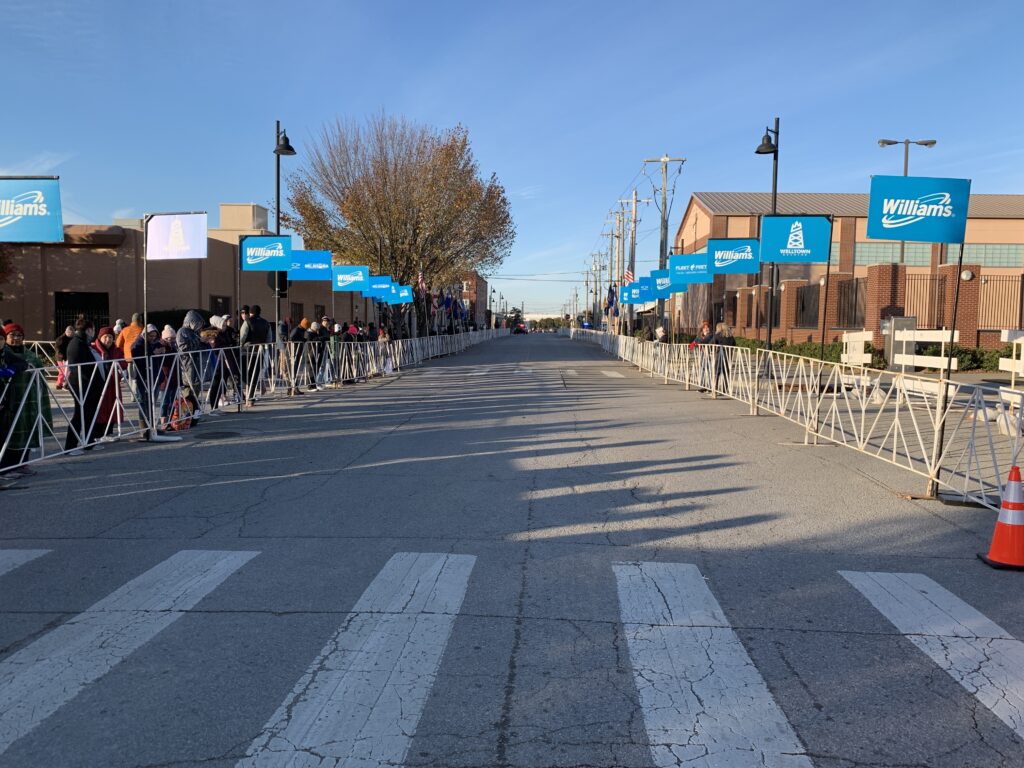 L-Poles set up outside at finish line with many spectators watching.