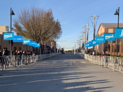 L-Poles set up outside at finish line with many spectators watching.