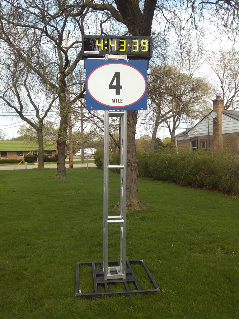 Digital clock on mile marker truss stand.