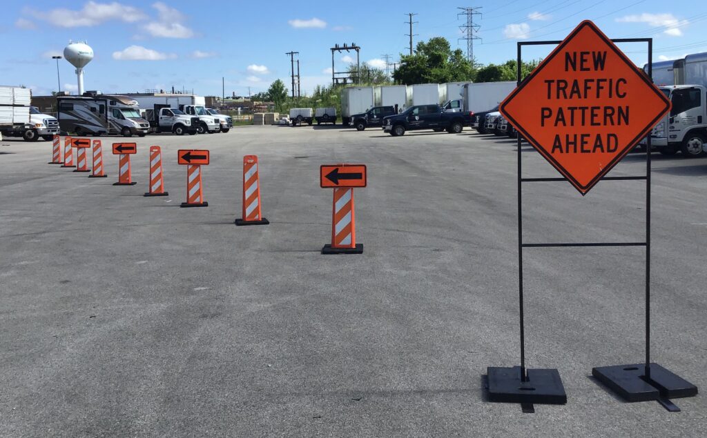 Verticades set up outside with a "New Traffic Pattern Ahead" sign.