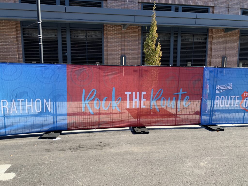 Perimeter patrol fencing with signage set up outside.